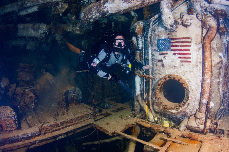 Spiegel Grove - A diver hovers in the forward engine room at 140 ft deep