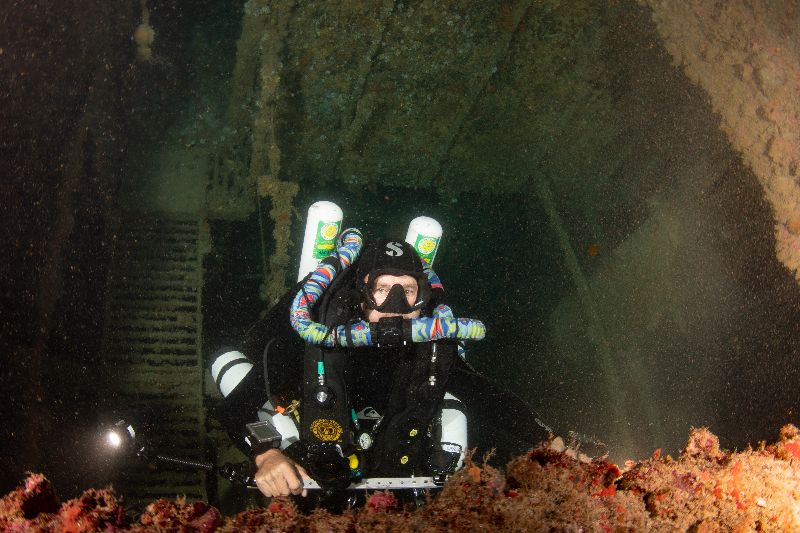 Ande - A diver exploring the interior of the wreck