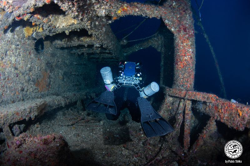 Ande - A rebreather diver explores the exterior of the wreck