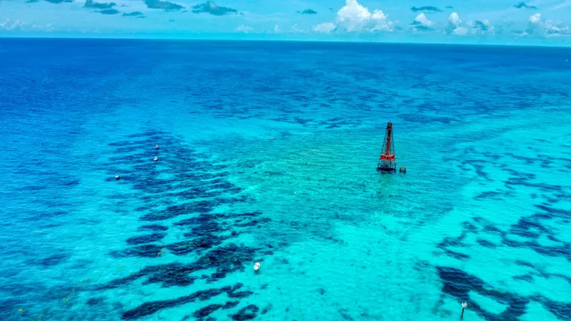 Sombrero - An aerial view of Sombrero reef and its lighhouse