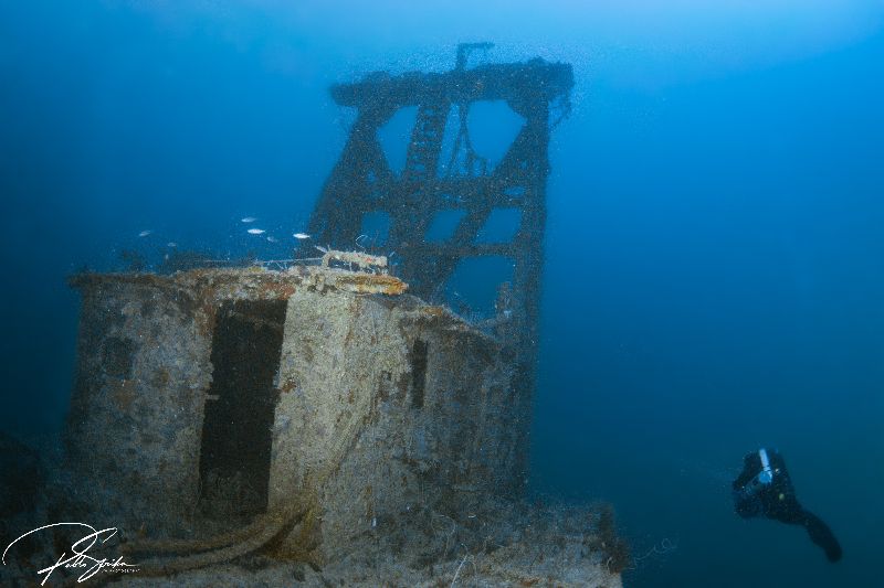 Ronald B Johnson - A diver scooters around the Chris and Corey dredge