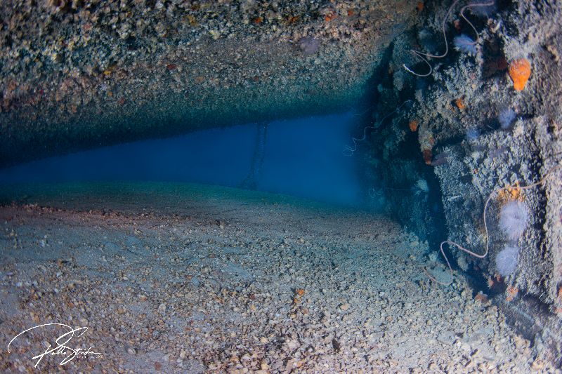 Ronald B Johnson - The famous "swim through". Divers can swim underneath the RBJ hull resting over by the CNC port side