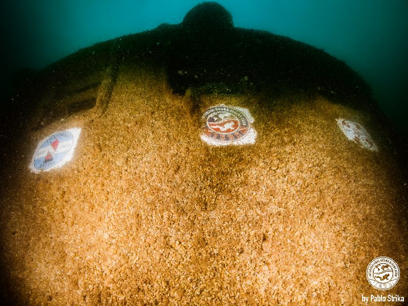 Simbad - The wheelhouse of this wreck features all the logos of the parties that made this wonderful dive site a reality
