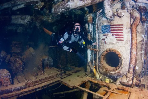 Spiegel Grove - A diver hovers in the forward engine room at 140 ft deep
